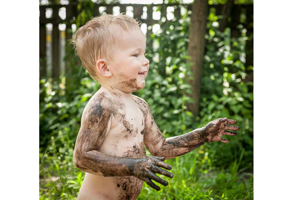 Child playing with poop