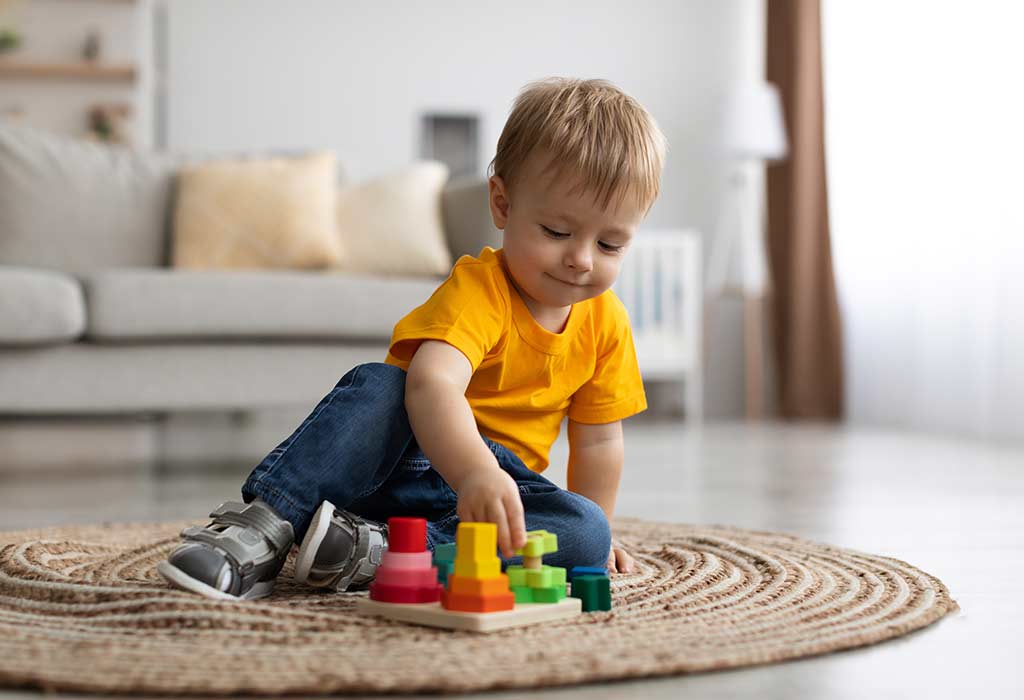 Toddler solving a sorting puzzle