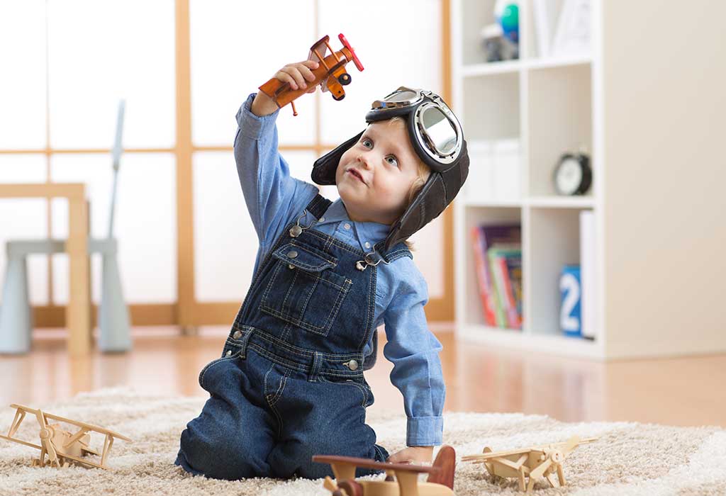 Imaginative toddler playing solo