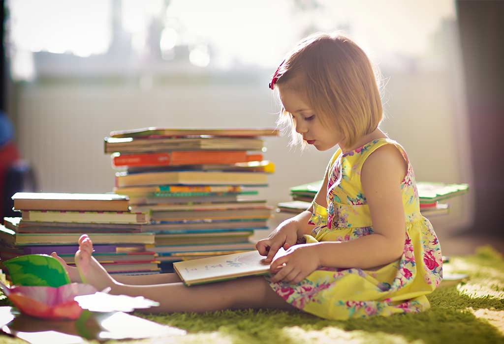 Child reading a book calmly